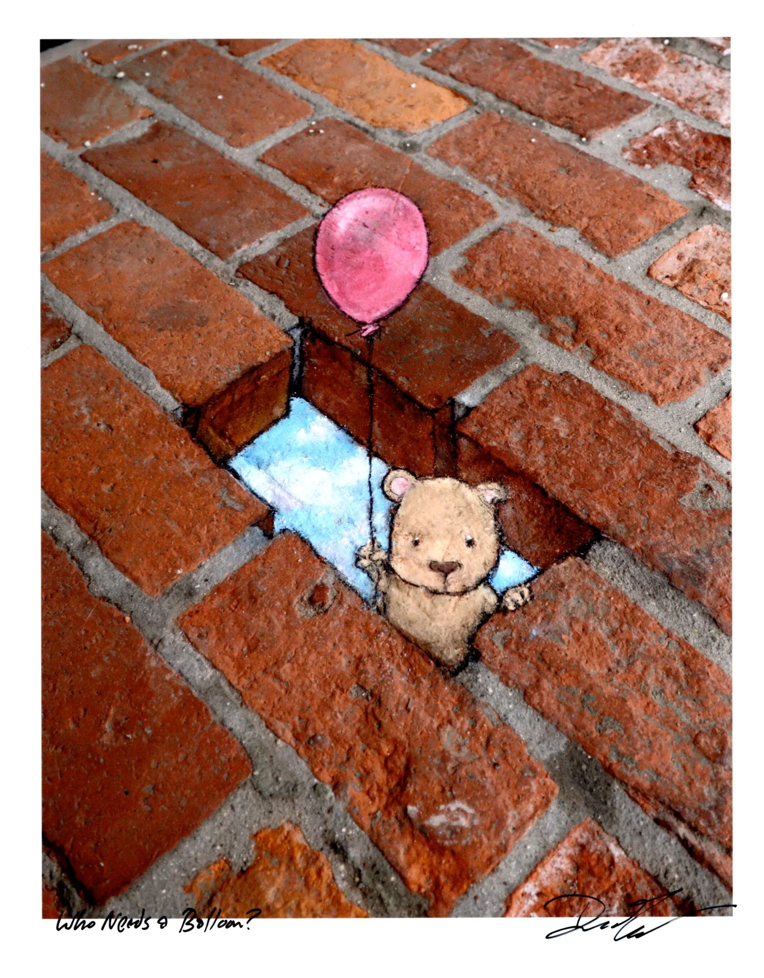 Chalk art on a brick pathway, that makes it appear as a brick is missing, through which we see a cloudy sky below, and a small teddy bear looking creature holding a balloon peeking through the opening and looking at the viewer.