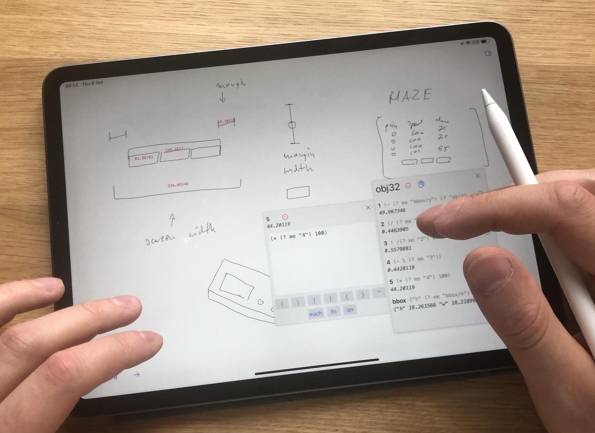Close up of someone working on an iPad. Looking closely, we can see that the things being drawn are also being understood and interacted with in a more traditional text GUI.