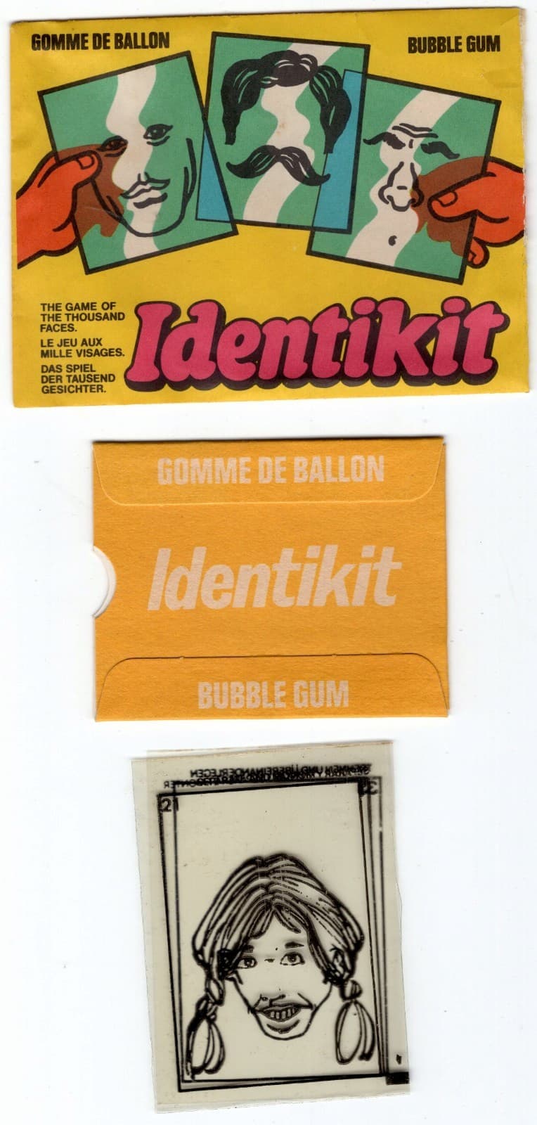 Vintage bubble gum packaging for 'Identikit' showing three components: The top wrapper features a yellow background with an illustration showing how three transparent overlay cards can be combined to create different faces - one card shows eyes, another a mustache, and the third shows glasses and a nose. The wrapper includes text in multiple languages: 'GOMME DE BALLON,' 'BUBBLE GUM,' 'THE GAME OF THE THOUSAND FACES,' 'LE JEU AUX MILLE VISAGES,' and 'DAS SPIEL DER TAUSEND GESICHTER' with the game name 'Identikit' in pink lettering. The middle piece shows an orange sleeve with white text reading 'GOMME DE BALLON,' 'Identikit,' and 'BUBBLE GUM.' The bottom piece displays 3 included game cards, each a transparent card which, when overlapping, depict a black and white illustrated portrait of a smiling person with braided hair and a mustache?!