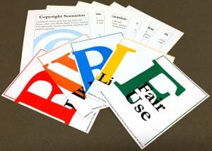 Image of Copyright: The Card Game cards fanned out on a surface.